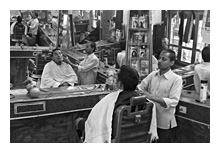 photo of The Barber Shop with a customer being shaved